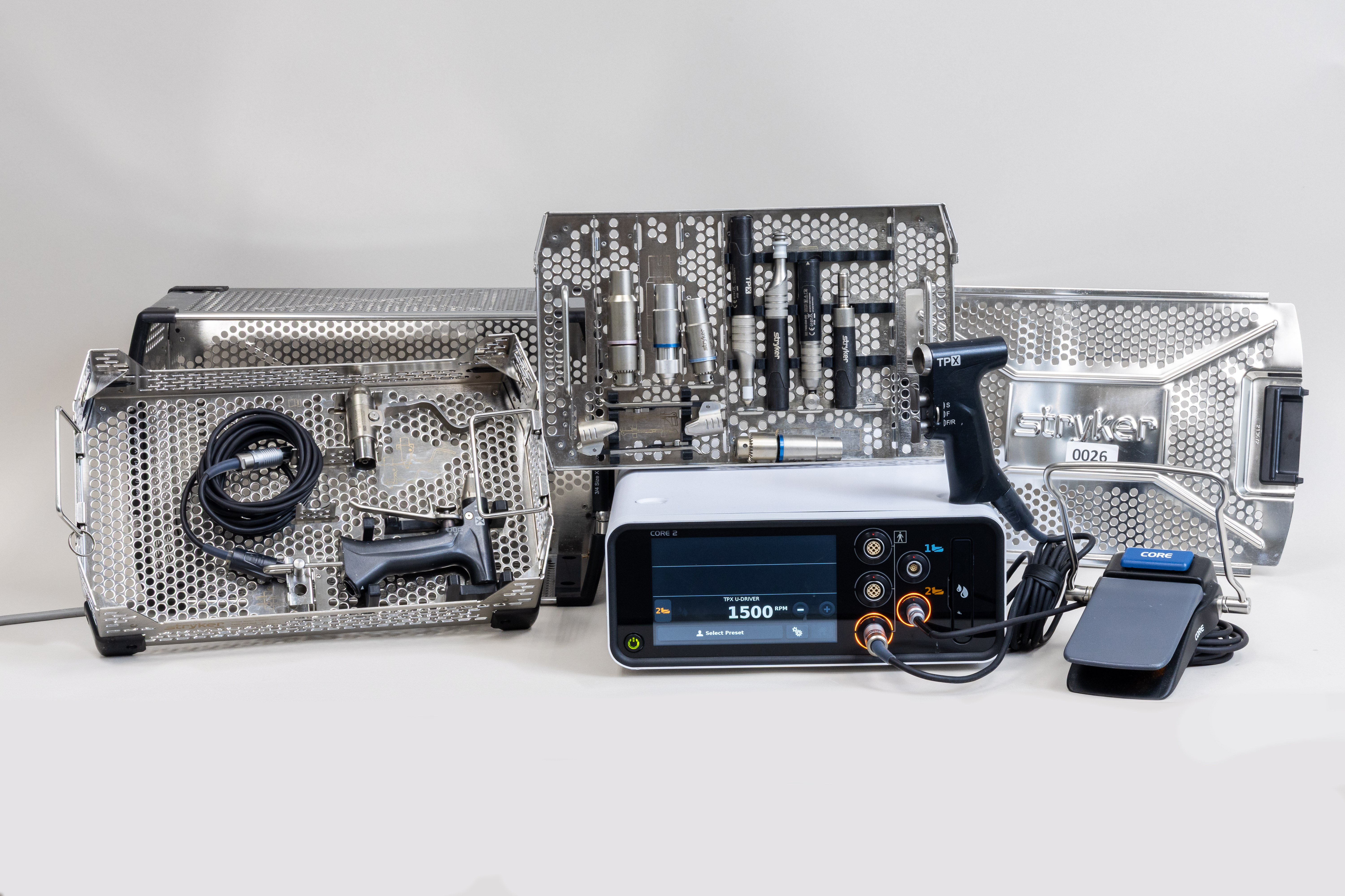 Stryker TPX Surgical Power Tool Set with CORE 2 Console including micro drill, sagittal saw, oscillating saw, reciprocating saw, wire driver, foot pedal, power cords, and sterilization cases.