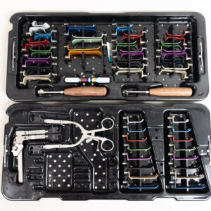 Stealth Surgical ACF Side Loading Cervical Retractor System with color-coded cervical blades, side-loading frames, locking handles, depth gauge, and sterilization case.