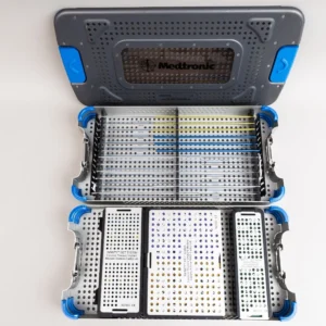 Medtronic INFINITY OCT occipitocervical thoracic implant set with titanium tapered rods, multi-axial screw caddies, and domino connector modules in sterilization case.