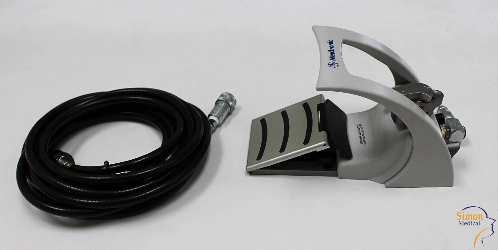 Medtronic Midas Rex PC700 pneumatic foot control with pneumatic hose for compatible MR7 and MR8 surgical power systems.