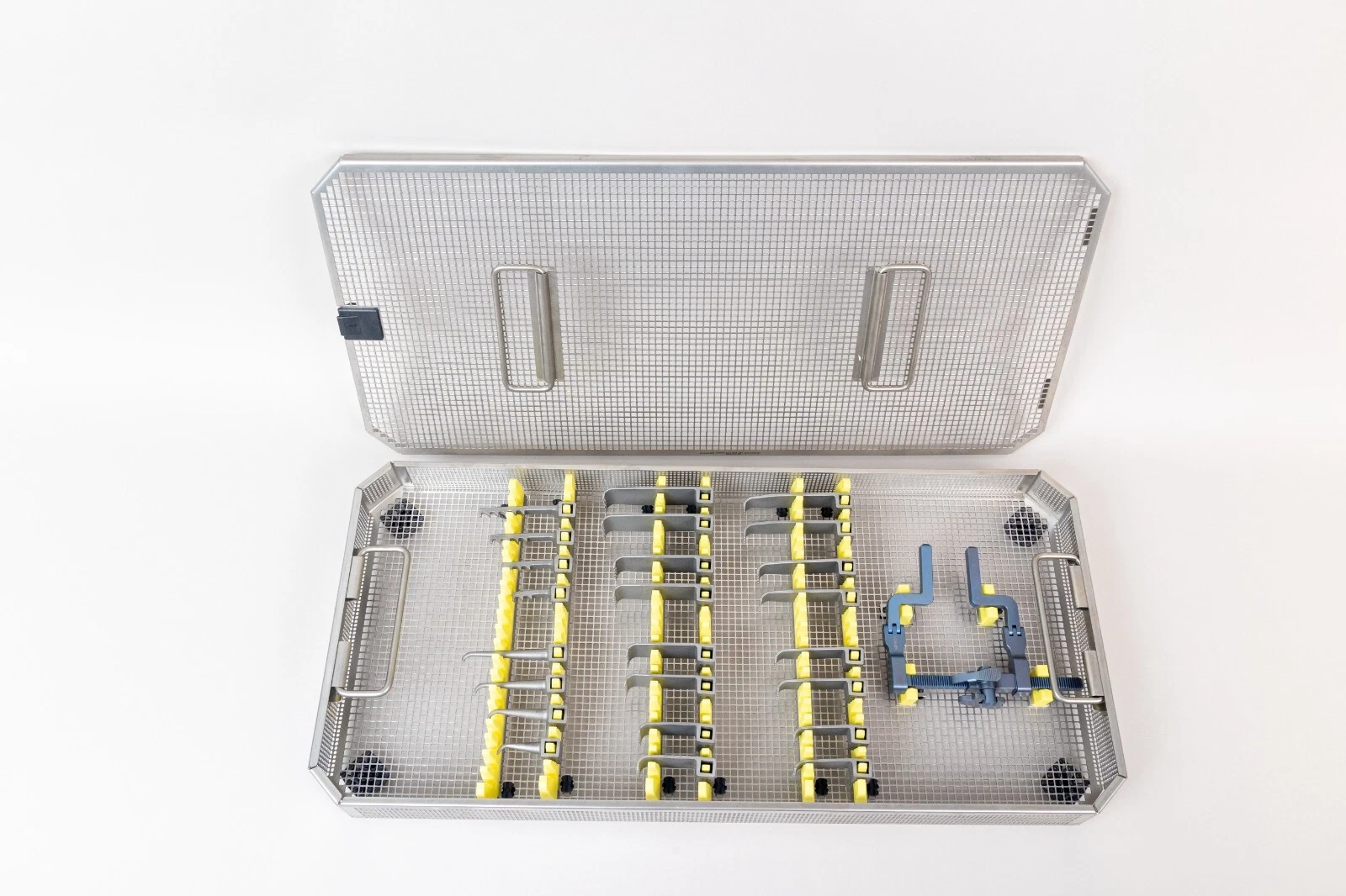 Aesculap Titanium McCulloch Lumbar Retractor System with hinged titanium frame, wide, narrow, hook, and toothed blades in sterilization container for posterior lumbar spine surgery.