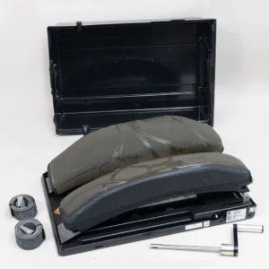 Mizuho OSI Wilson Plus Radiolucent Frame Model 5319G with positioning pads, transport case, adjustment crank, and patient positioning straps for spine surgery.